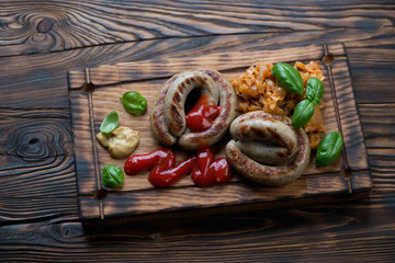Grilled sausages with braised cabbage in a rustic wooden setting