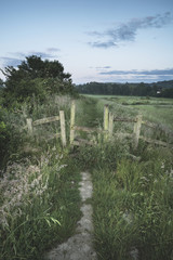 Beautiful vibrant Summer sunrise over English countryside landsc
