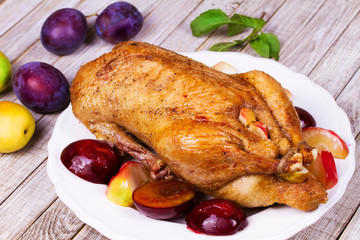 Roasted apple and plum stuffed duck