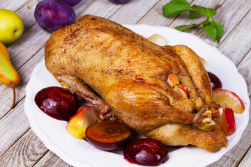 Roasted apple and plum stuffed duck