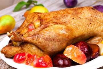 Roasted apple and plum stuffed duck