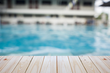 empty plywood and blur swimming pool background can be used for