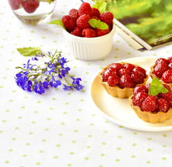Fruit raspberry tart cakes on a table