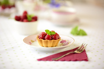 Fruit raspberry tart cakes on a table