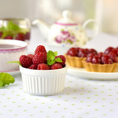 Fruit raspberry tart cakes on a table