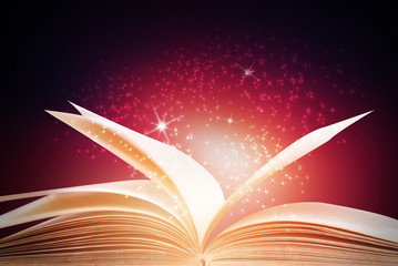 Abstract red magic book on wooden background