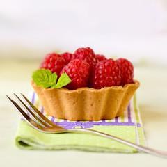 Fruit raspberry tart cakes on a table
