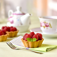 Fruit raspberry tart cakes on a table