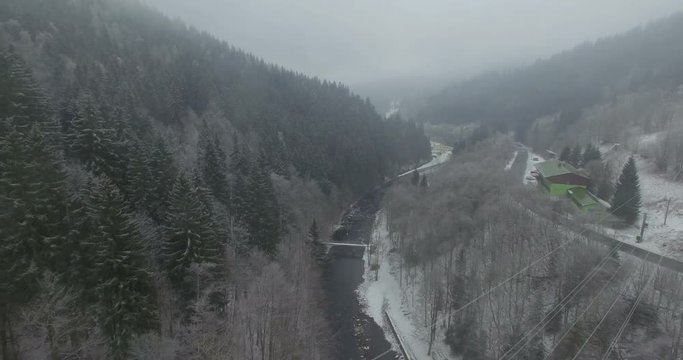 Aerial: The reservoir and bridge of Spindler Mill, Czech Republic in winter