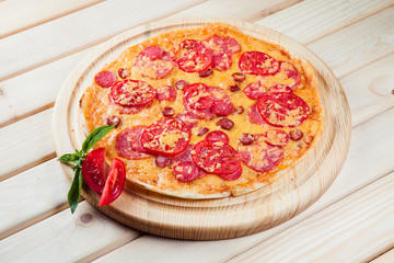 Pizza on the wooden background