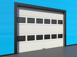Sectional industrial door with windows on blue industrial wall