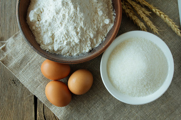 Flour, sugar and eggs top view