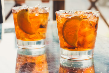 Two coctails boulvardier on glass table