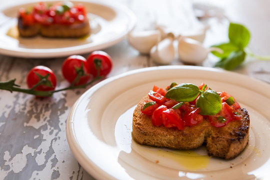 Closeup of Italian bruschetta with tomato and basil