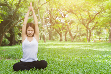 Young woman doing yoga in the park,Close up yoga  relax in nature
