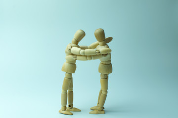 wooden dummy couple hug eachother love care