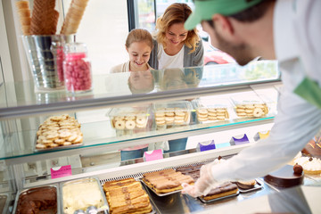 Obraz na płótnie Canvas Customers in pastry shop