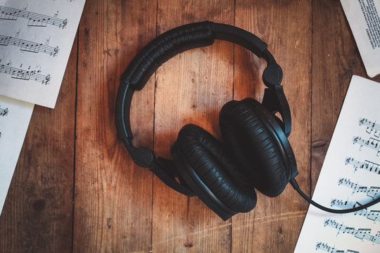Black headphones on the wood table