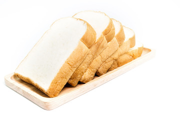 sliced bread with a strawberry jam on wood plate