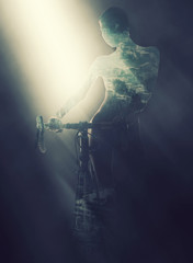 Silhouette of a woman with bicycle. Double exposure