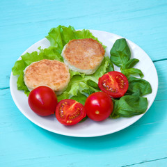Chicken cutlets with cherry tomatoes