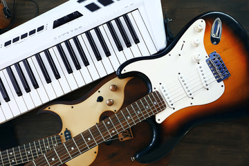 Fototapeta na wymiar Electric guitars and synthesizer closeup