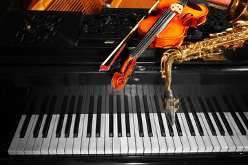 Violin with saxophone and piano, closeup