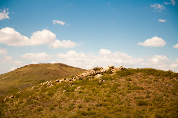 The parched rocky hills and sky summer day.