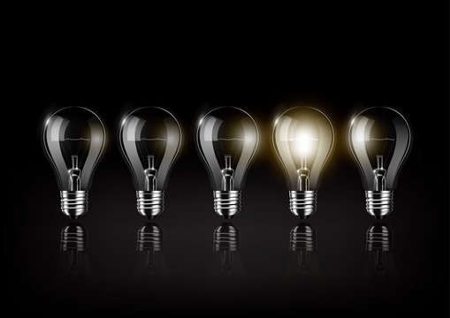 Glowing light bulb is among a lot of turned off light bulbs on black background , concept idea , Transparent Vector