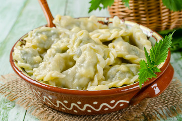 Dumplings with cheese and nettles in a bowl