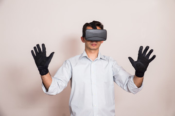 Man using virtual reality glasses and gloves