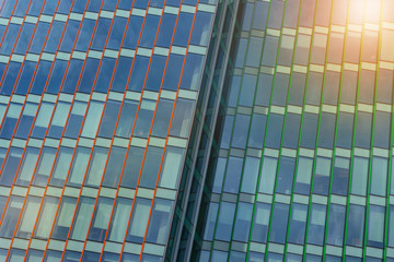 modern office building of glass and concrete. panoramic windows with background blue sky.