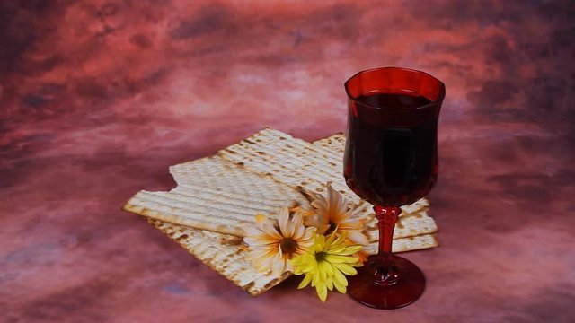 Passover background. wine and matzoh jewish holiday bread over wooden board.