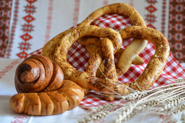 Homemade bread: pretzel bun Snail with poppy seeds and a croissant with jam