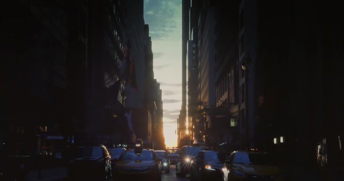 NEW YORK - Circa July, 2016 - A sunset establishing shot of "Manhattanhenge" as seen down 44th Street in Manhattan.  	