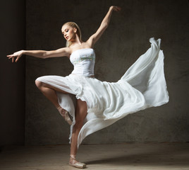 Beautiful ballet dancer in white costume with waving skirt dancing - obrazy, fototapety, plakaty