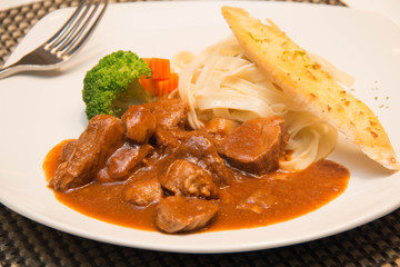 Pork stew with pasta