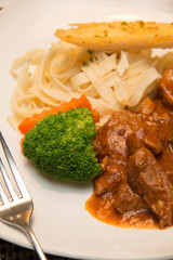 Pork stew with pasta