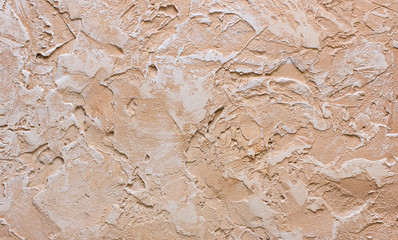 textured plaster - texture in brown and beige tones. Decorative plaster texture on the wall - art brush stroke background