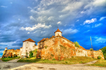 Sunset light with clouds storm at Old Fortress Cetatuia in Brasov, Transylvania, Romania