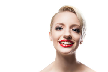 Cheerful blonde-haired model with red lips smiling at camera