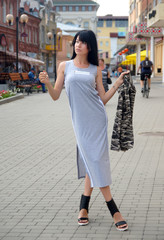 Beautiful girl posing on city streets