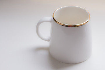 White coffee mug with gold edges