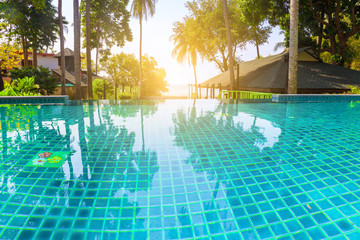 Swimming pool in the  resort beside the beach