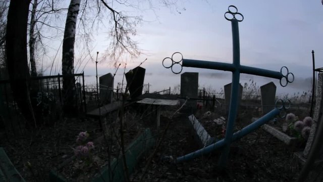 creepy cemetery monument in a fog
