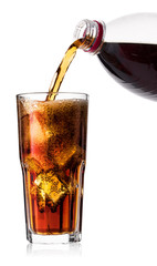 Cold cola with ice in glass and bottle