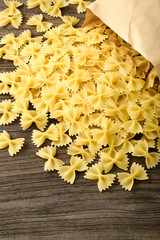 dried pasta on wooden board