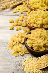 dried pasta on wooden board