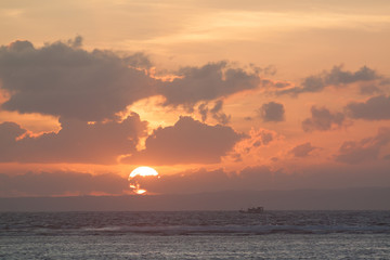 Picture of empty long tail boat on tropical beach at sunset. Ko li pe island.