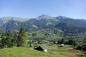 Fototapeta na wymiar Village in the beautiful landscape of Alps near Grindelwald